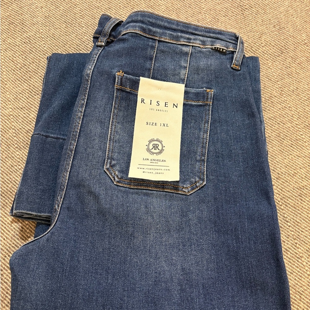 Risen tummy control mid rise wide flare jeans.